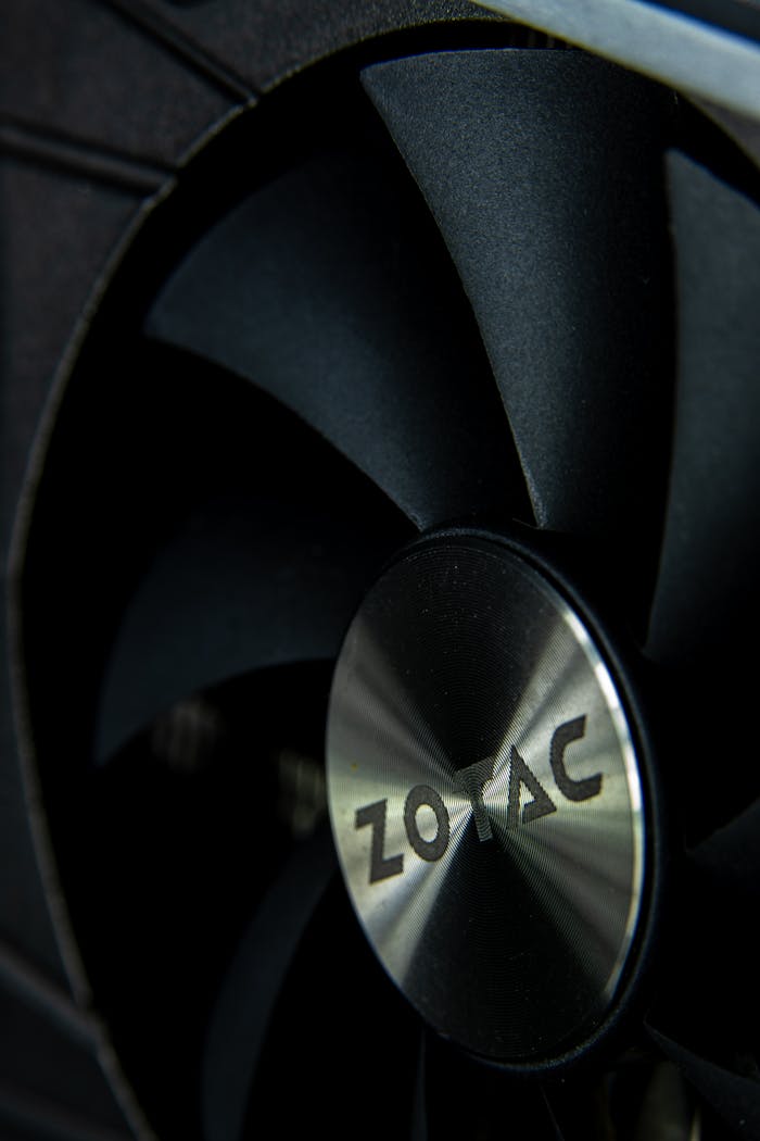 Detailed view of a black fan blade from a modern computer component, highlighting innovation in technology.